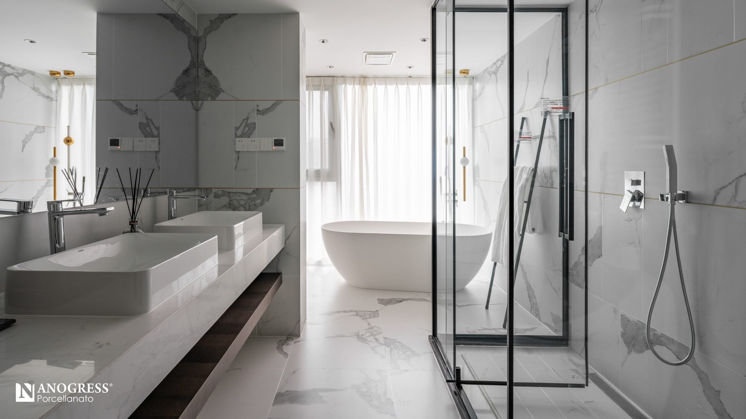 Bathroom with white interior, shower with glass enclosure, white floors, and white tub