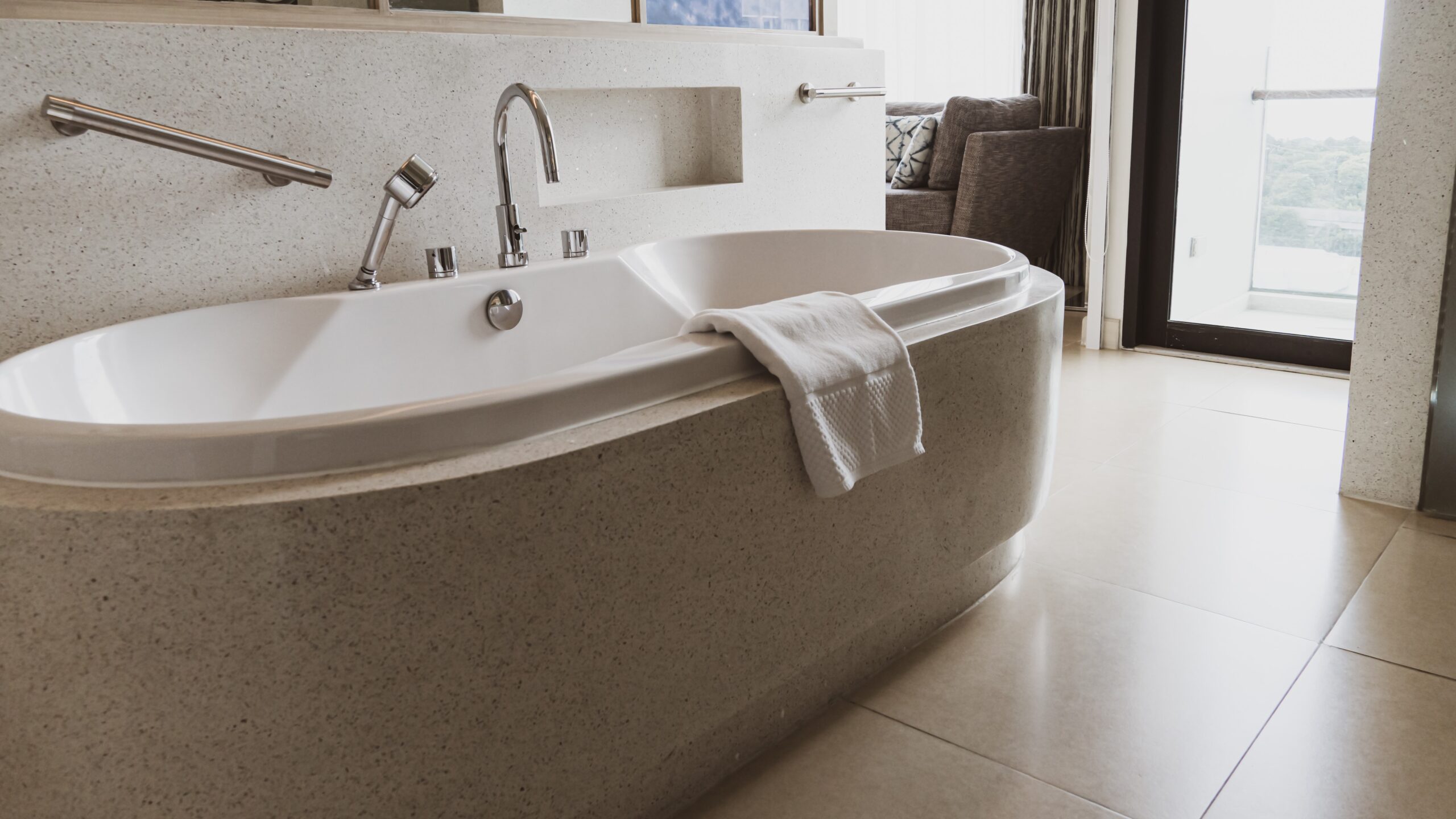 Interesting bathtub remodel with beige foundation and tile floors inside rest area