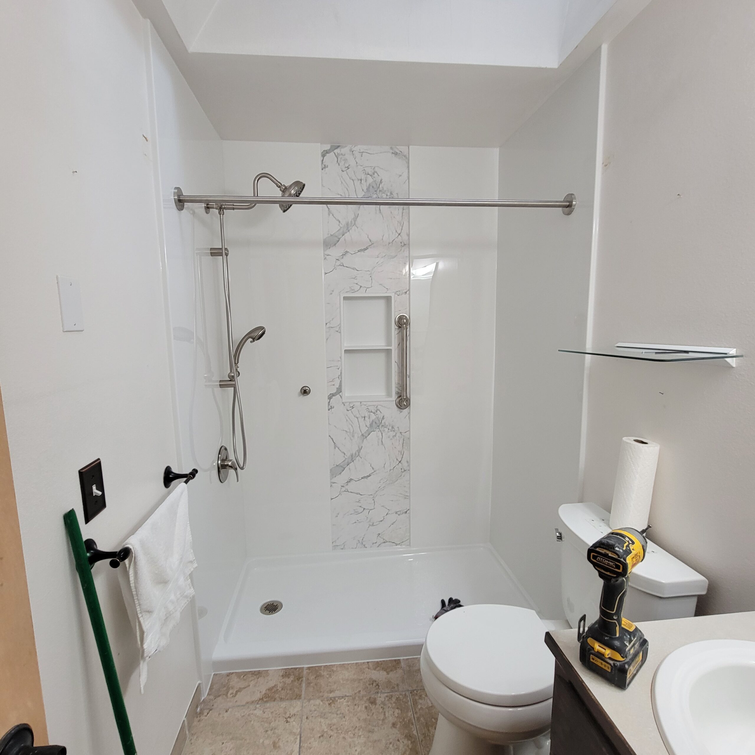 A white acrylic tub installed in bathroom