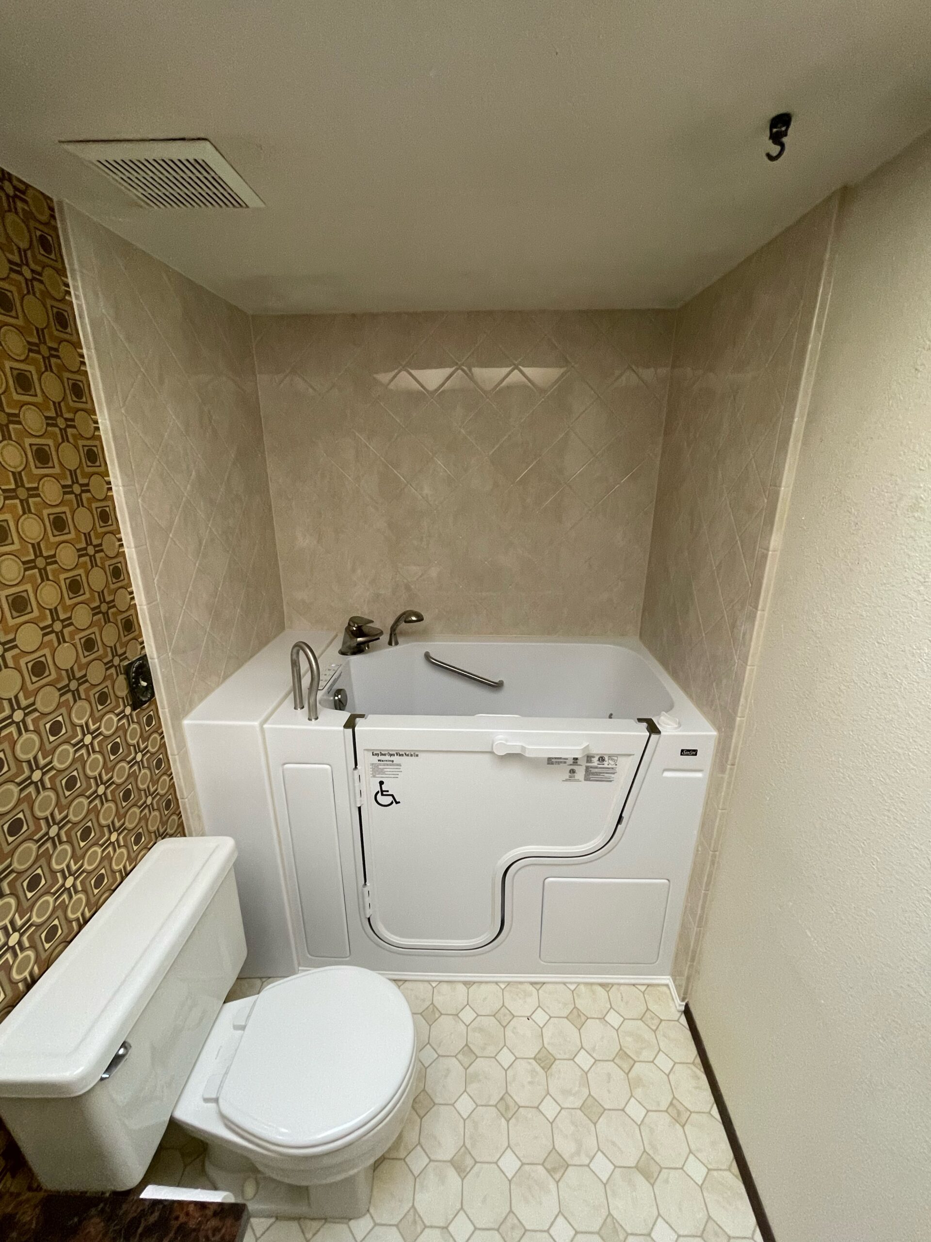 Walk-in tub with grab bar in Kennewick, WA bathroom