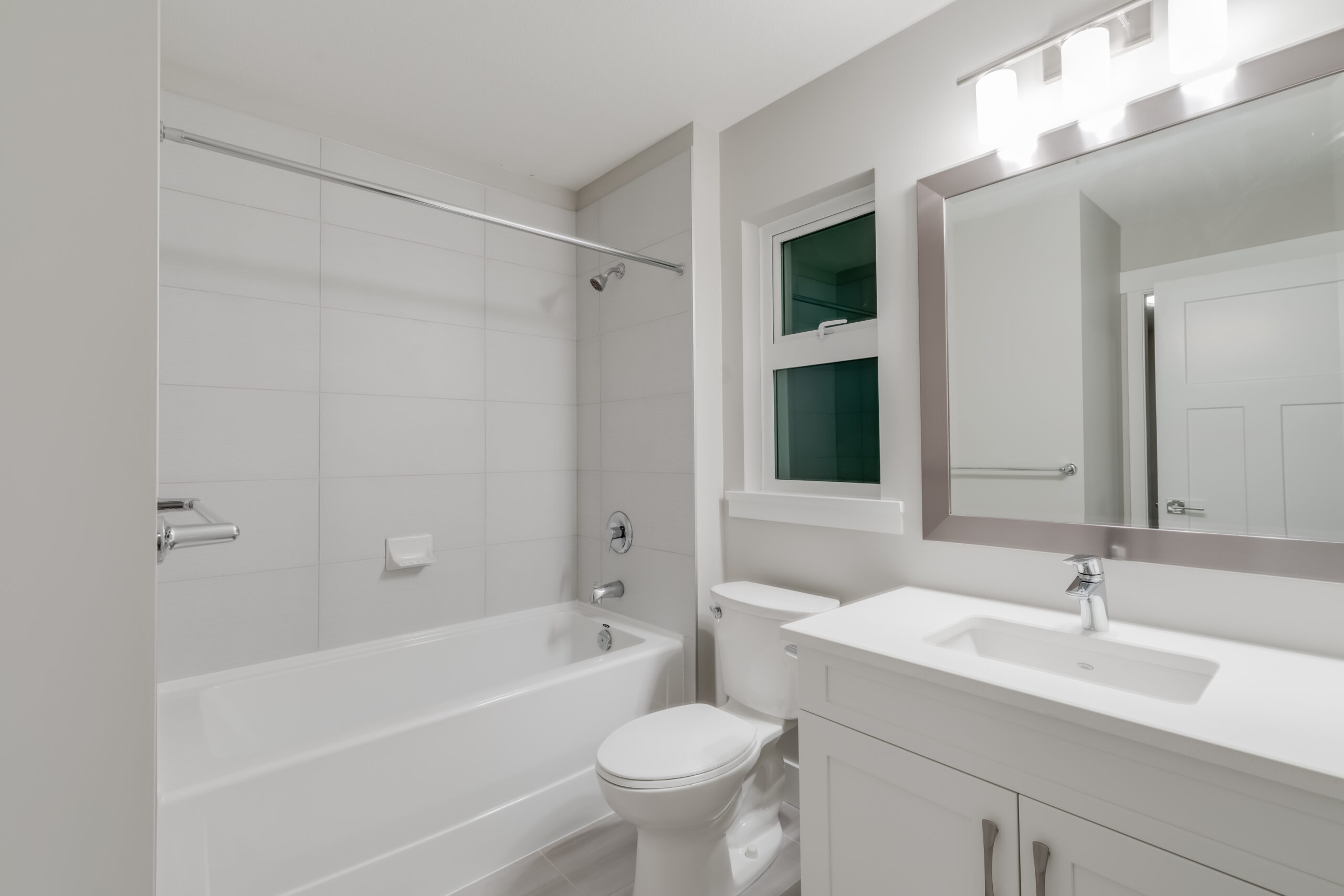 New bathtub with modern fixtures and a shower curtain