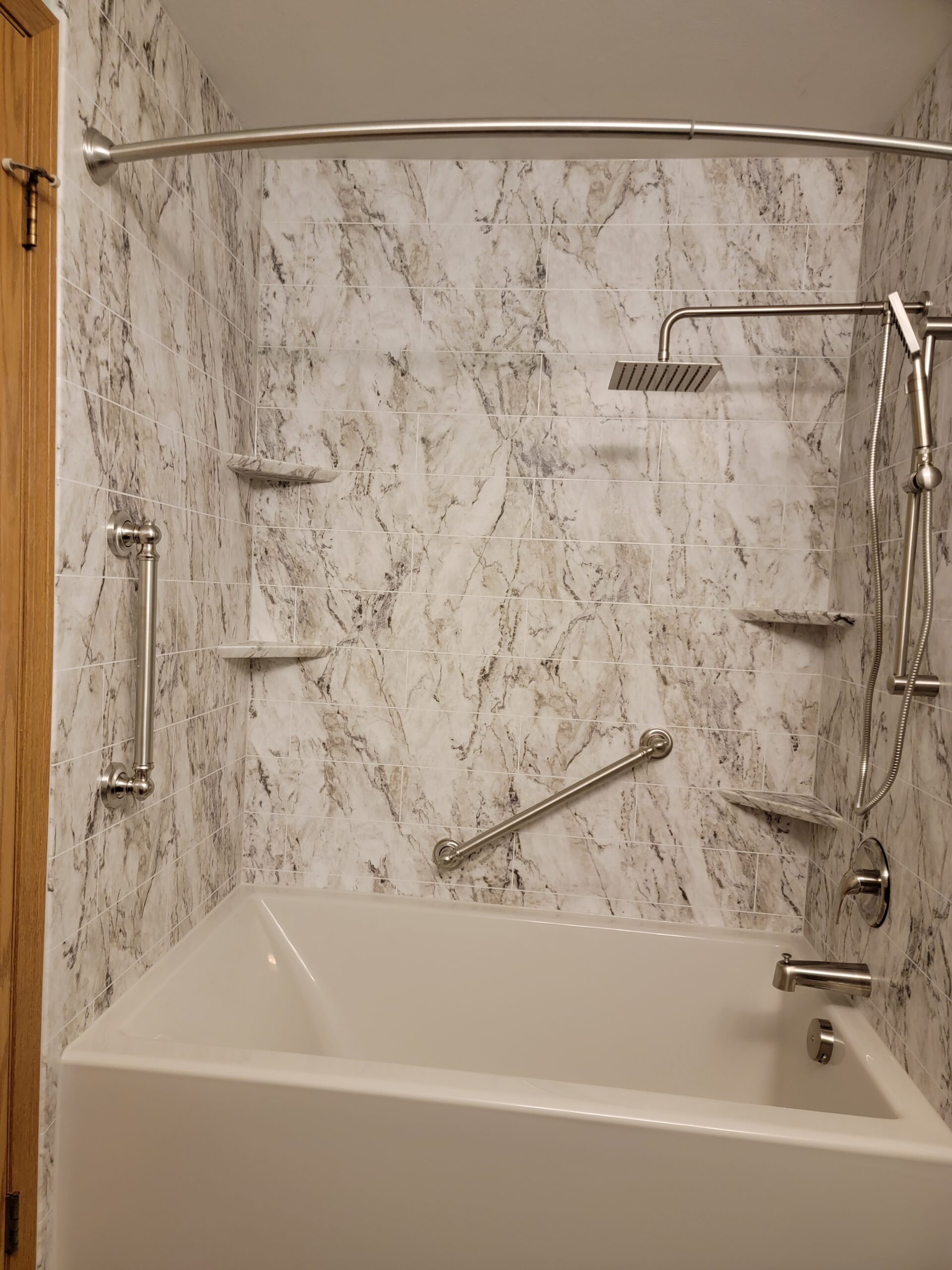 A new walk-in tub makes bathing in an elegant bathroom comfortable and effortless.